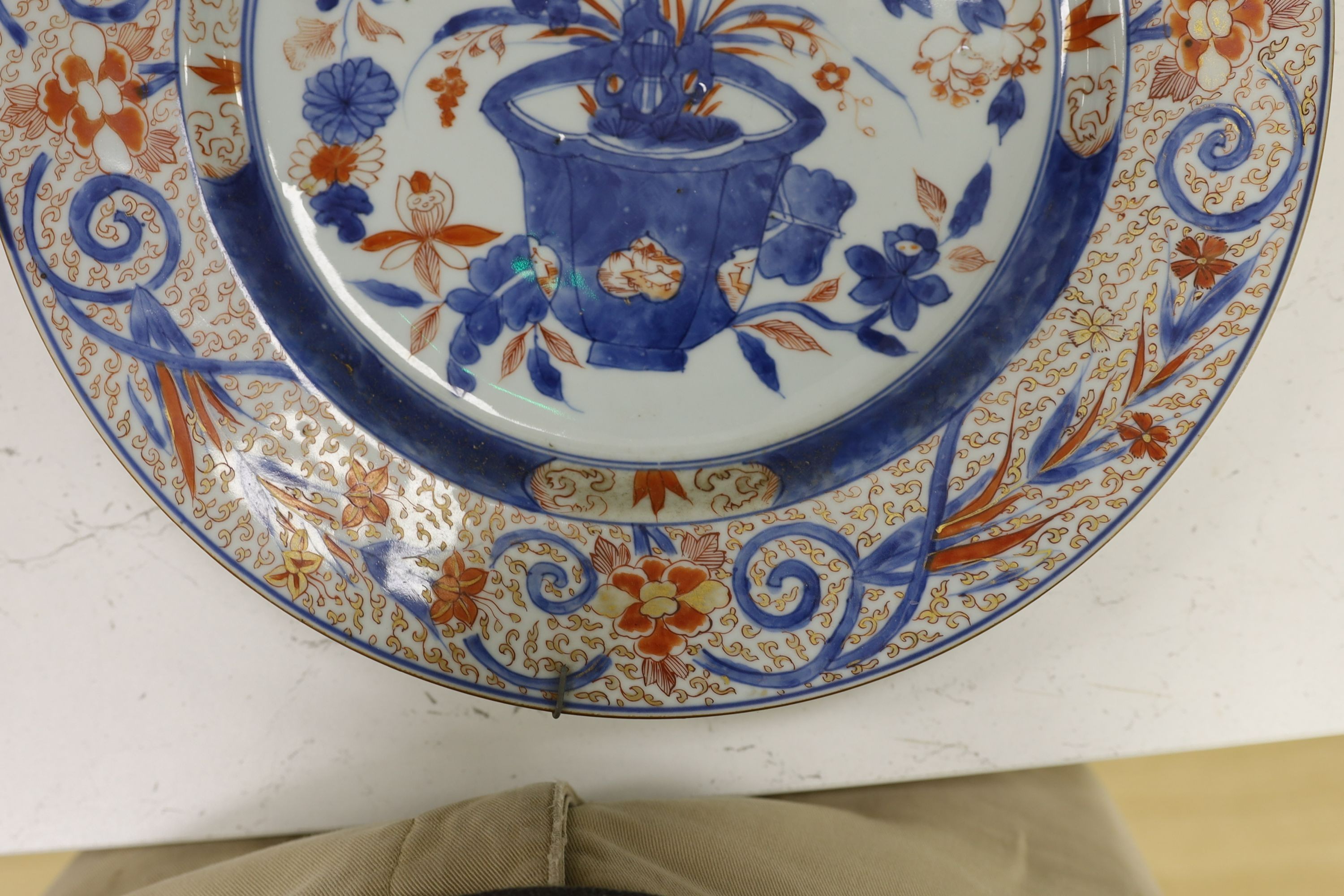 A pair of Chinese Imari dishes, Kangxi period, on wooden stands, 31 cms diameter., Provenance - D.C.Monk & Son, former dealers based in Kensington Church Street, London W8